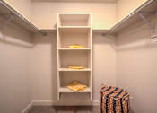 Thumbnail 10 of 21 - Model walk-in closet