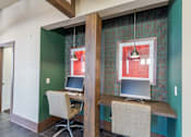 Thumbnail 22 of 26 - A room with a desk and a computer.
