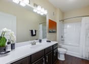 Thumbnail 23 of 31 - a bathroom with a sink and a toilet and a shower