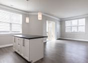 Thumbnail 12 of 24 - an empty kitchen and living room in an apartment