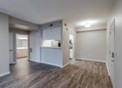 Thumbnail 2 of 27 - the living room and kitchen of a new home with wood flooring