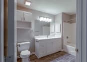 Thumbnail 9 of 27 - a bathroom with a toilet sink and a mirror