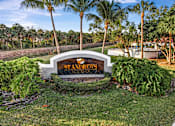 Thumbnail 1 of 31 - A sign that says "St. Andrews Golf Club" is in front of some trees.