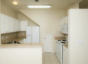 Thumbnail 7 of 14 - nterior Kitchen White Appliances at Magnolia Place Apartment, Gainesville, Florida