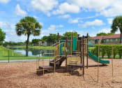 Thumbnail 11 of 13 - Playground For Children at St. Andrews Palm Beach Apartments, West Palm Beach, FL