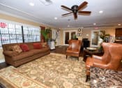 Thumbnail 27 of 28 - Resident Clubhouse sitting area at Green Oaks Apartments, Tampa, Florida