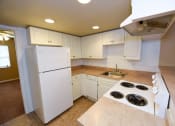 Thumbnail 4 of 28 - Kitchen with refrigerator, oven and dishwasher  at Green Oaks Apartments, Florida, 33616