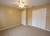 Thumbnail 12 of 28 - Spacious Bedroom with Carpet at Green Oaks Apartments, Tampa, FL