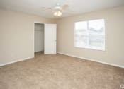 Thumbnail 13 of 23 - Bedroom with ceiling fan and light and window at  Springbrook Townhomes Apartments,Tallahassee, Florida,32303