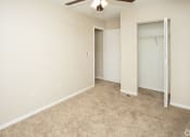 Thumbnail 12 of 23 - Bedroom with ceiling fan and light at Springbrook Townhomes Apartments,Tallahassee, Florida, FL