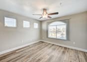 Thumbnail 19 of 22 - Empty bedroom with wood style flooring at Borgata Condominiums Apartments, Las Vegas