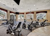 Thumbnail 11 of 22 - Fitness center with recumbent bikes and equipment at Borgata Condominiums Apartments, Las Vegas, NV