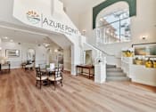 Thumbnail 5 of 25 - an open concept living room and dining room with hardwood flooring and a large sign at Azure Point at Encinitas, Encinitas