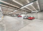 Thumbnail 4 of 25 - a parking garage with cars in it at Azure Point at Encinitas, Encinitas California