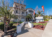 Thumbnail 3 of 25 - a large white house with palm trees in front of it at Azure Point at Encinitas, Encinitas, 92024