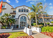 Thumbnail 2 of 25 - an  apartment building with palm trees in front of it at Azure Point at Encinitas, Encinitas, CA