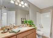 Thumbnail 15 of 22 - Bathroom with granite vanity and soaking tub at Borgata Condominiums Apartments, Nevada, 89103