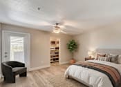 Thumbnail 14 of 22 - Bedroom with builtin storage and ceiling fan at Borgata Condominiums Apartments, Las Vegas, NV 89103