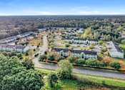 Thumbnail 14 of 14 - A bird's eye view of a residential area with houses and trees.