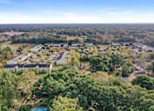 Thumbnail 13 of 14 - A bird's eye view of a residential area with houses and trees.