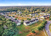 Thumbnail 9 of 14 - A bird's eye view of a residential area with houses and trees.