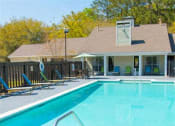 Thumbnail 22 of 23 - Pool Side Relaxing Area With Sundeck at Springwood Townhomes Apartments, Tallahassee, Florida