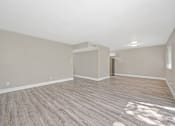 Thumbnail 10 of 43 - A room with wooden flooring and a white ceiling.