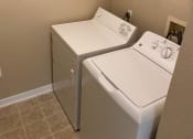Thumbnail 4 of 4 - Convenient Laundry Room at The Palms Club Orlando Apartments, Orlando, 32811-2402