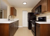 Thumbnail 31 of 31 - a kitchen with a stove refrigerator and a sink
