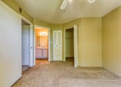 Thumbnail 3 of 15 - A room with a carpeted floor and a white door.