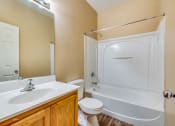 Thumbnail 16 of 25 - a bathroom with a sink toilet and shower and a tub