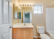 Thumbnail 15 of 25 - a bathroom with a sink toilet and a mirror