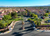 Thumbnail 4 of 25 - an aerial view of a neighborhood with houses and palm trees