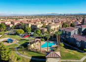Thumbnail 2 of 25 - an aerial view of a neighborhood with houses and a swimming pool