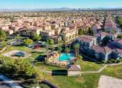 Thumbnail 3 of 25 - an aerial view of a neighborhood with houses and a swimming pool