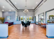 Thumbnail 23 of 23 - a dining room with a table and chairs and a chandelier