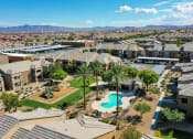 Thumbnail 1 of 23 - an aerial view of a neighborhood with a swimming pool and palm trees