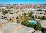 Thumbnail 17 of 23 - an aerial view of a neighborhood with houses and a swimming pool