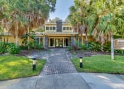 Thumbnail 11 of 25 - a house with palm trees in front of it