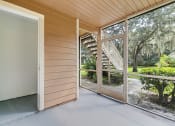 Thumbnail 20 of 25 - a sliding glass door opens to a porch with a view of a staircase