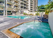 Thumbnail 5 of 32 - a swimming pool with a building in the background