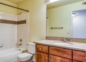 Thumbnail 17 of 25 - a bathroom with a sink toilet and a tub