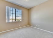 Thumbnail 23 of 30 - an empty living room with a large window