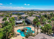 Thumbnail 19 of 30 - an aerial view of a community with a pool and palm trees