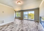 Thumbnail 12 of 17 - an empty living room with a sliding glass door to a balcony