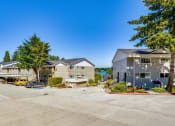 Thumbnail 3 of 17 - the enclave at homecoming landing apartments parking lot and buildings