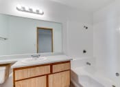 Thumbnail 30 of 32 - a bathroom with a sink toilet and bathtub at Pacific Harbors Sunrise Apartments, Las Vegas, NV, 89142