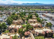 Thumbnail 27 of 32 - an aerial view of a neighborhood with houses and trees at Pacific Harbors Sunrise Apartments, Las Vegas, Nevada
