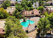 Thumbnail 1 of 32 - an aerial view of the resort style pool and hot tub at Pacific Harbors Sunrise Apartments, Las Vegas, NV