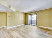 Thumbnail 27 of 39 - the spacious living room with sliding glass door to the patio
